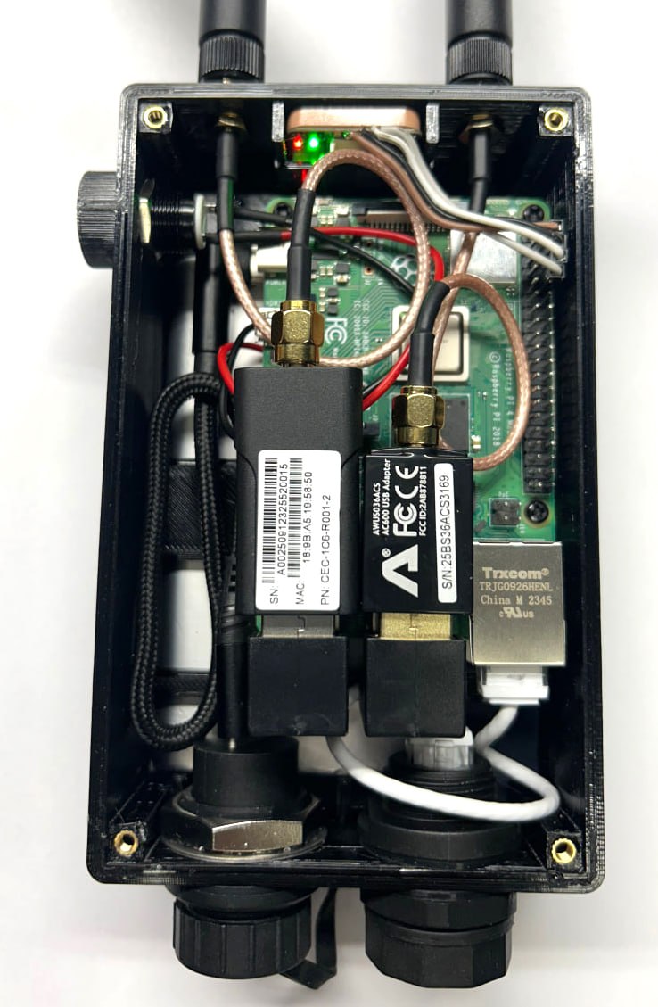 Inside a completed Patrol node: Raspberry Pi 4B, HaLow radio, ALFA Wi-Fi adapter, RJ45 and antenna bulkheads in the printed case.