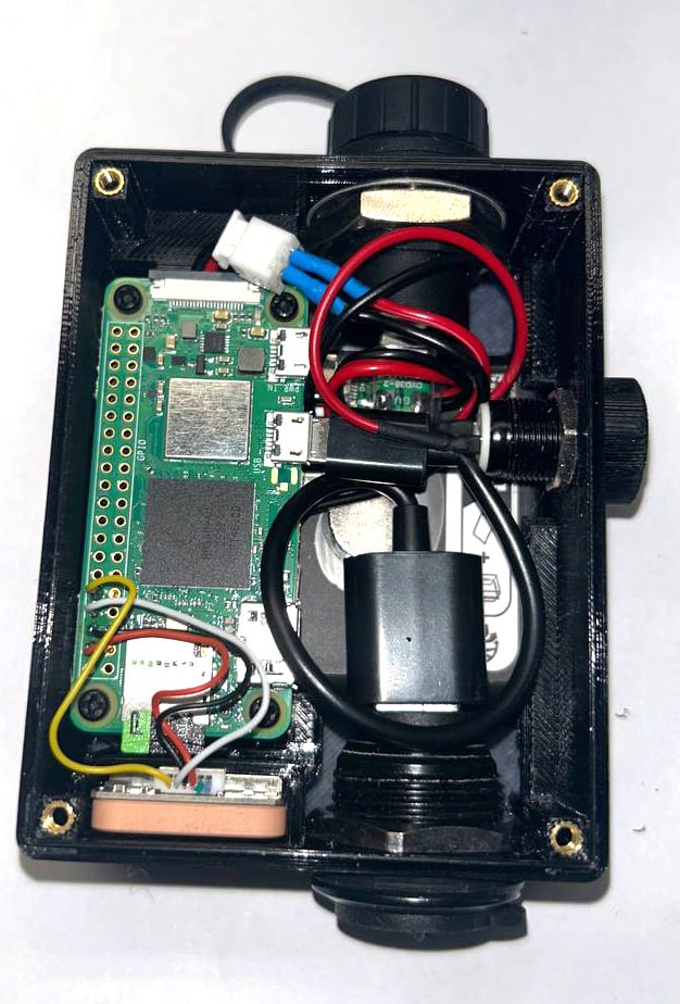 Inside a completed Scout node: Raspberry Pi Zero 2 W, PiSugar power board, and custom charge harness in the compact printed case.